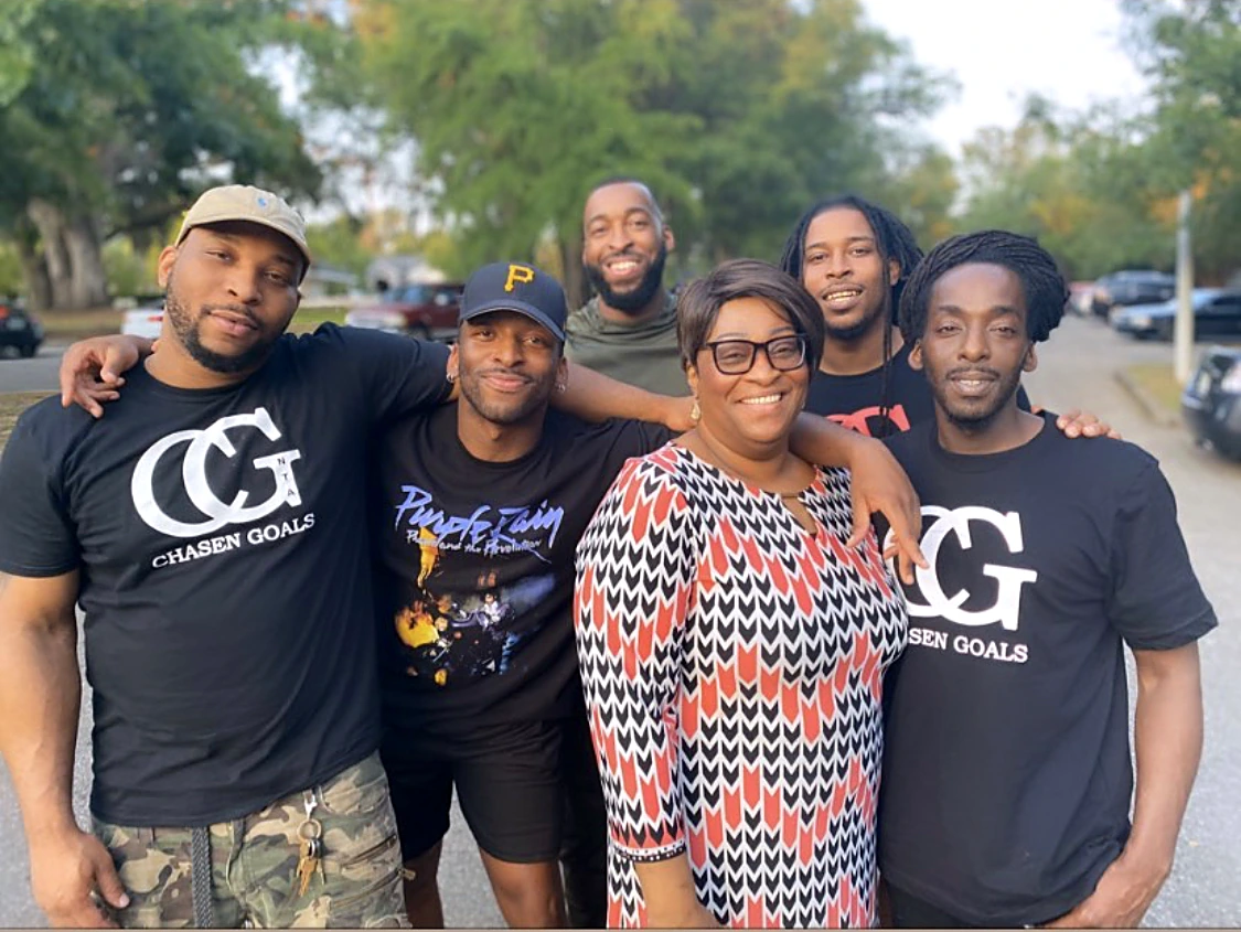 Marcus with his mother Iris Brown and his brothers