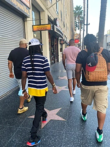 Marcus and his brothers in Hollywood